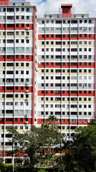 white and red concrete building during daytime
