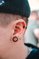 person wearing stud earrings