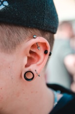 person wearing stud earrings