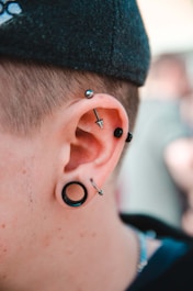 person wearing stud earrings