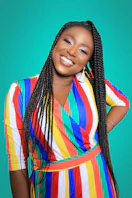 woman holding her hips while smiling