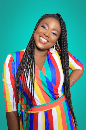 woman holding her hips while smiling