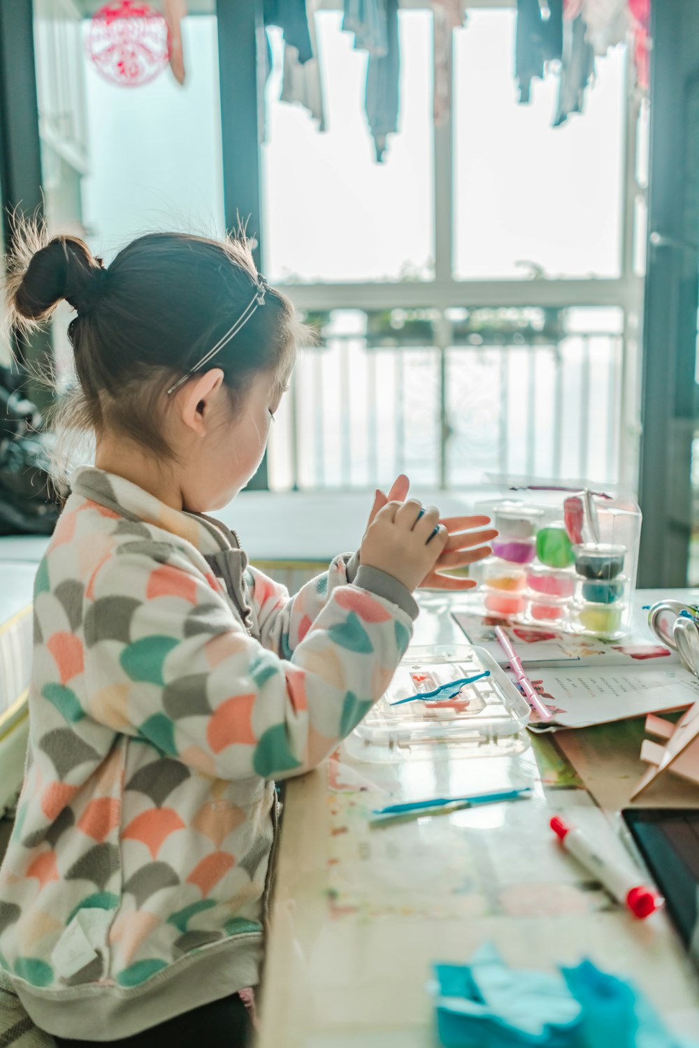 girl painting on table