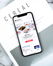 lack smartphone on top pf Cereal magazine