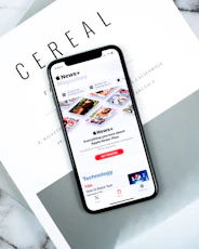 lack smartphone on top pf Cereal magazine