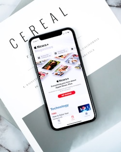 lack smartphone on top pf Cereal magazine
