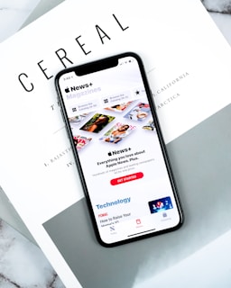 lack smartphone on top pf Cereal magazine