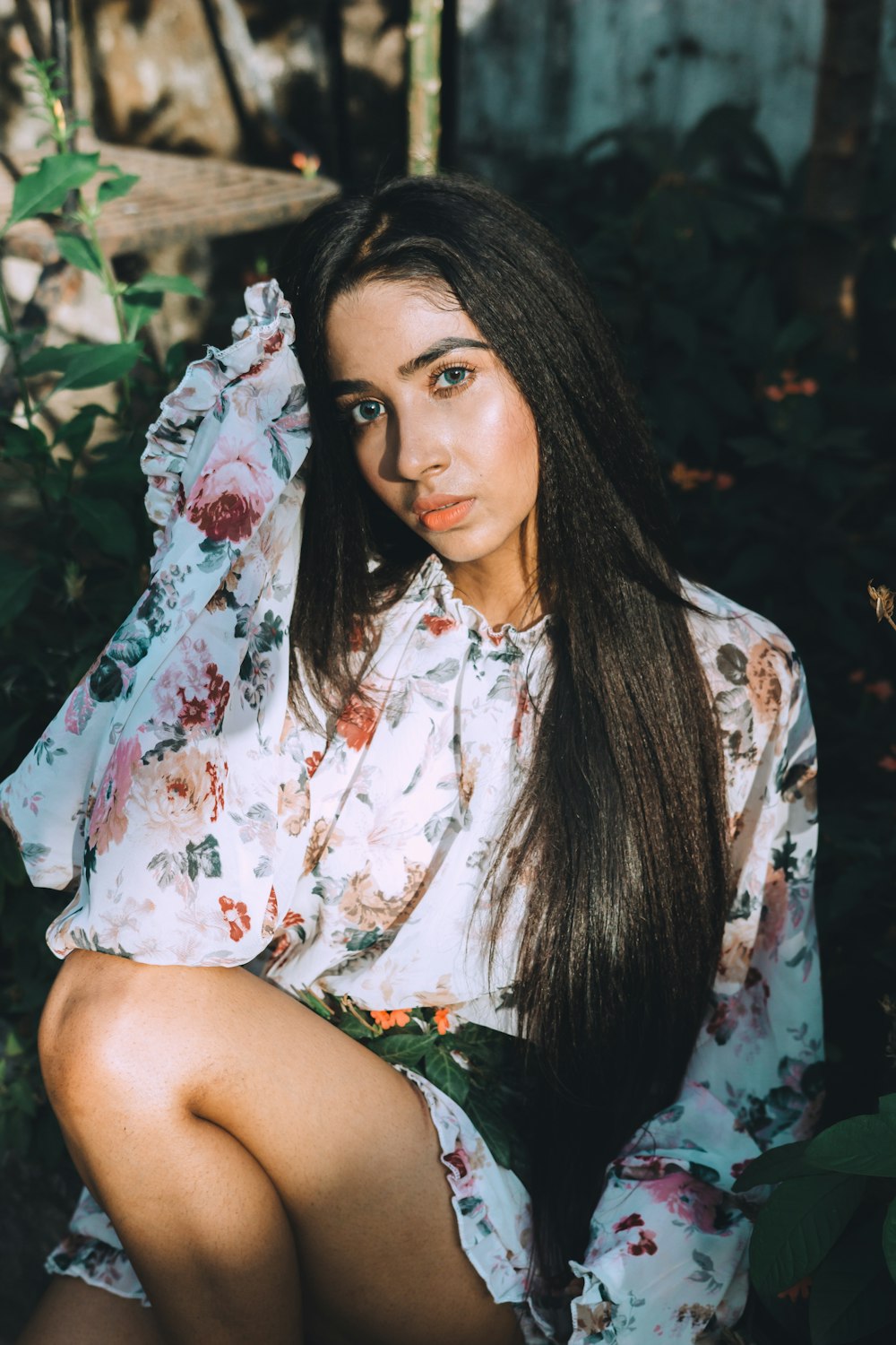 woman in white and pink floral long sleeved dress