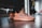 A close-up of stylish women's shoes on a wooden floor.