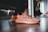 A close-up of comfortable flats in a vibrant color against a neutral background.
