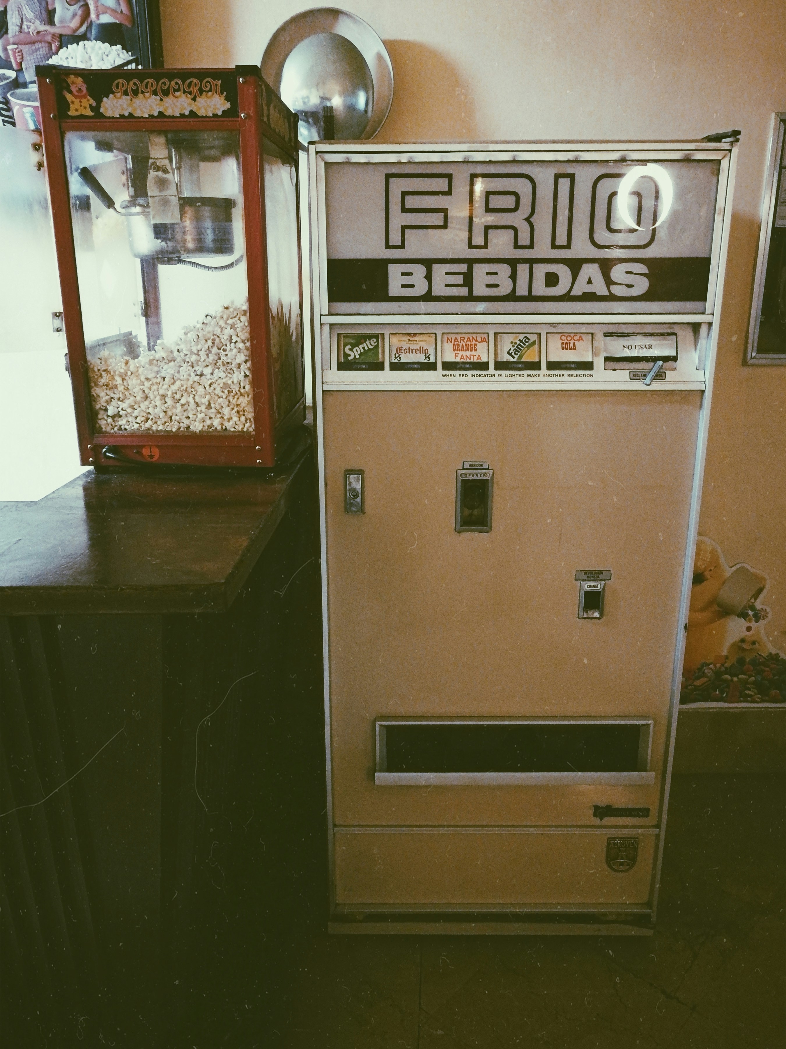 beige and white vendo machine inside lighted room