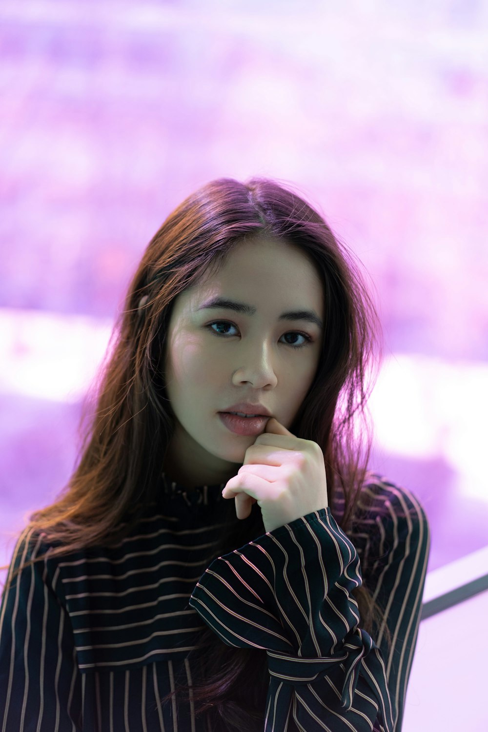 woman in black and white striped long sleeved shirt