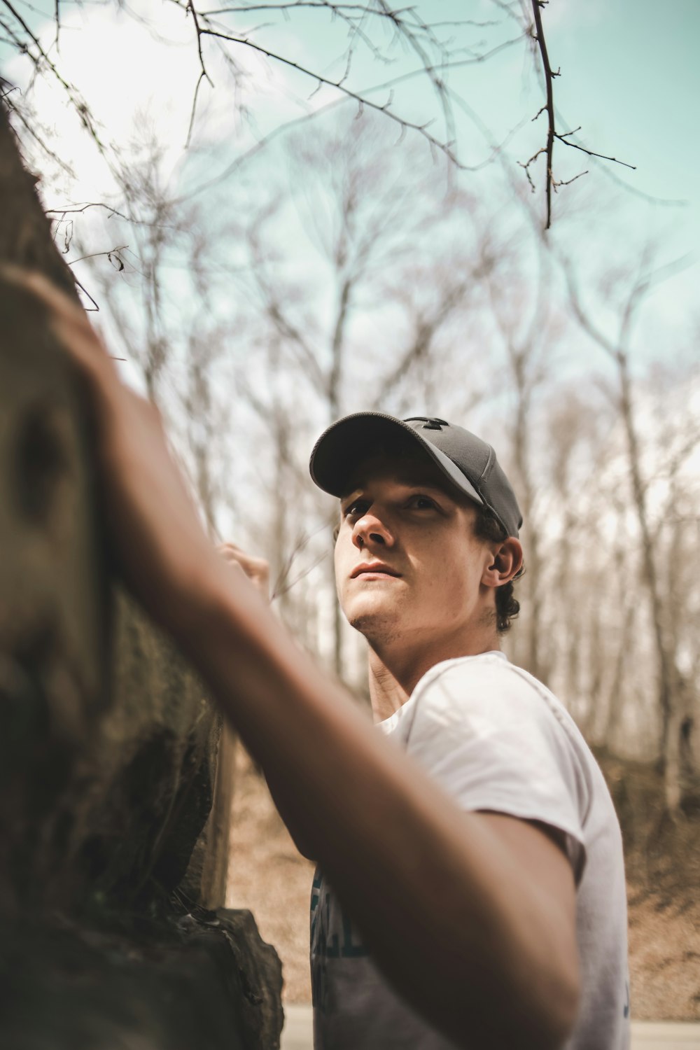 man in gray cap and white t-shirt