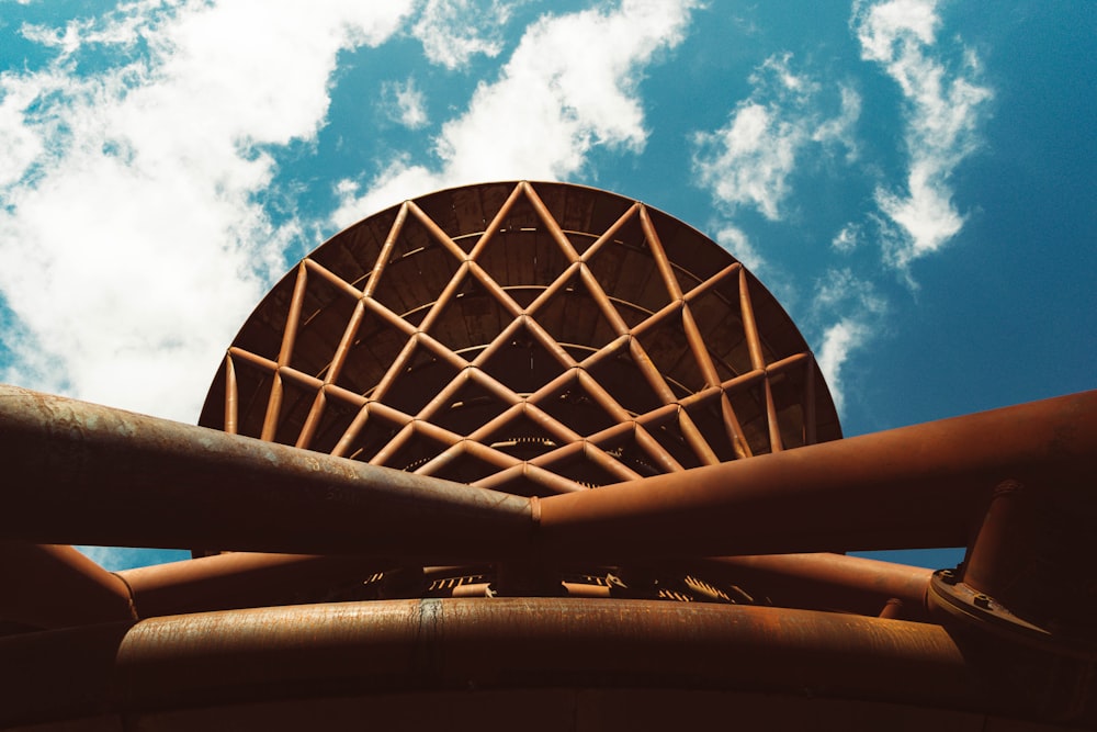 a large metal object with a sky background