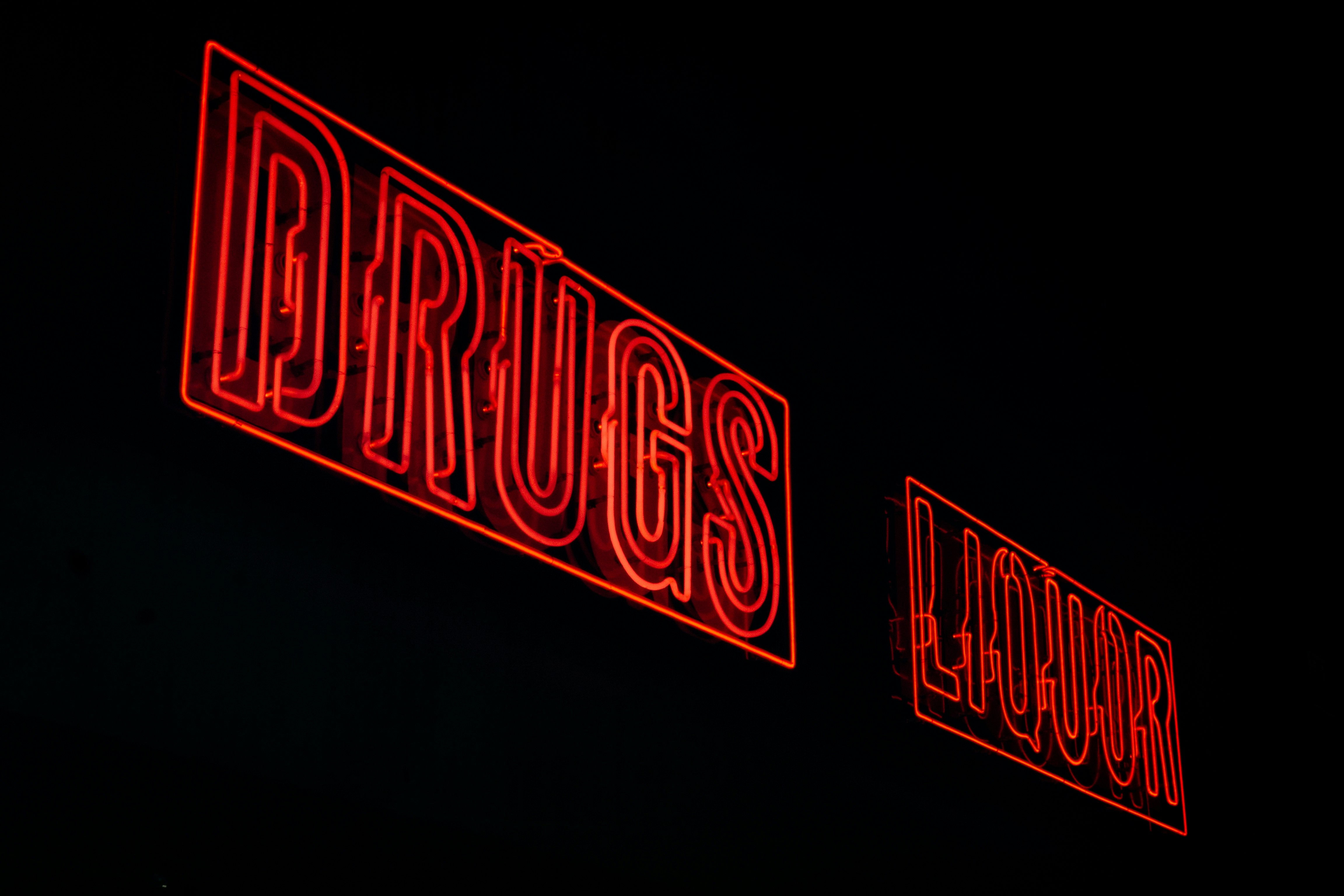 red drugs liquor neon signages