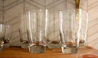 Set of clear glass cups with clean lines, arranged for easy sale.