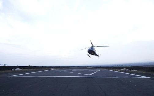 Completed helipad with clear markings and a helicopter ready for takeoff.