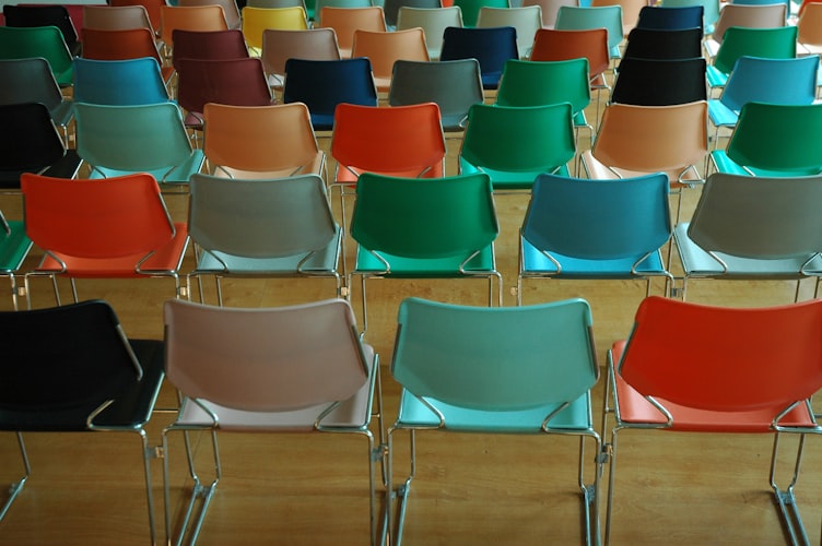 rows of colorful stacking chairs for fall of senior year class