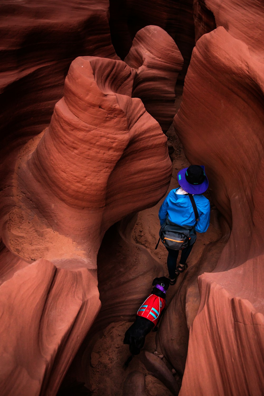 person walking inside cave