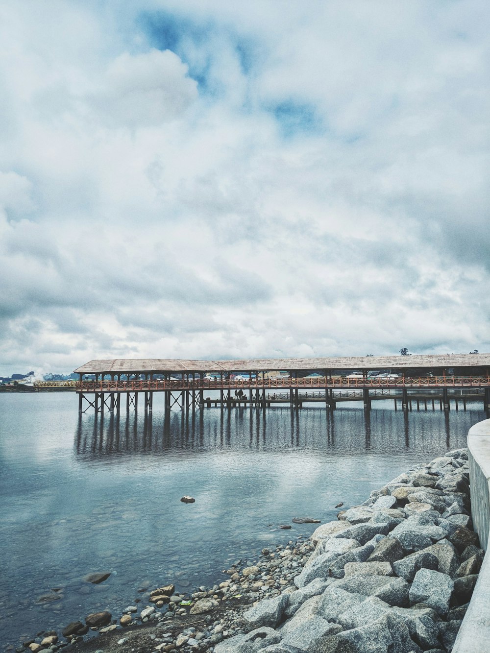 brown wooden beach house under white skies