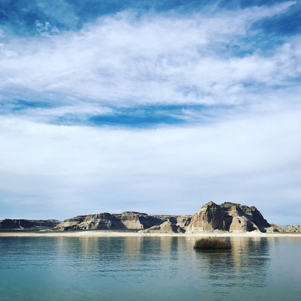 mountain near the body of water during daytime