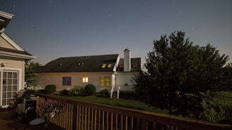 Stars Chimney Sweeps van parked outside a cozy California home at dusk.