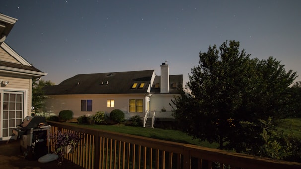 Stars Chimney Sweeps van parked outside a cozy California home at dusk.