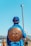 man standing while holding brown stick