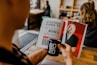 man reading magazine