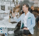 smiling man while holding smartphone