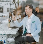 smiling man while holding smartphone