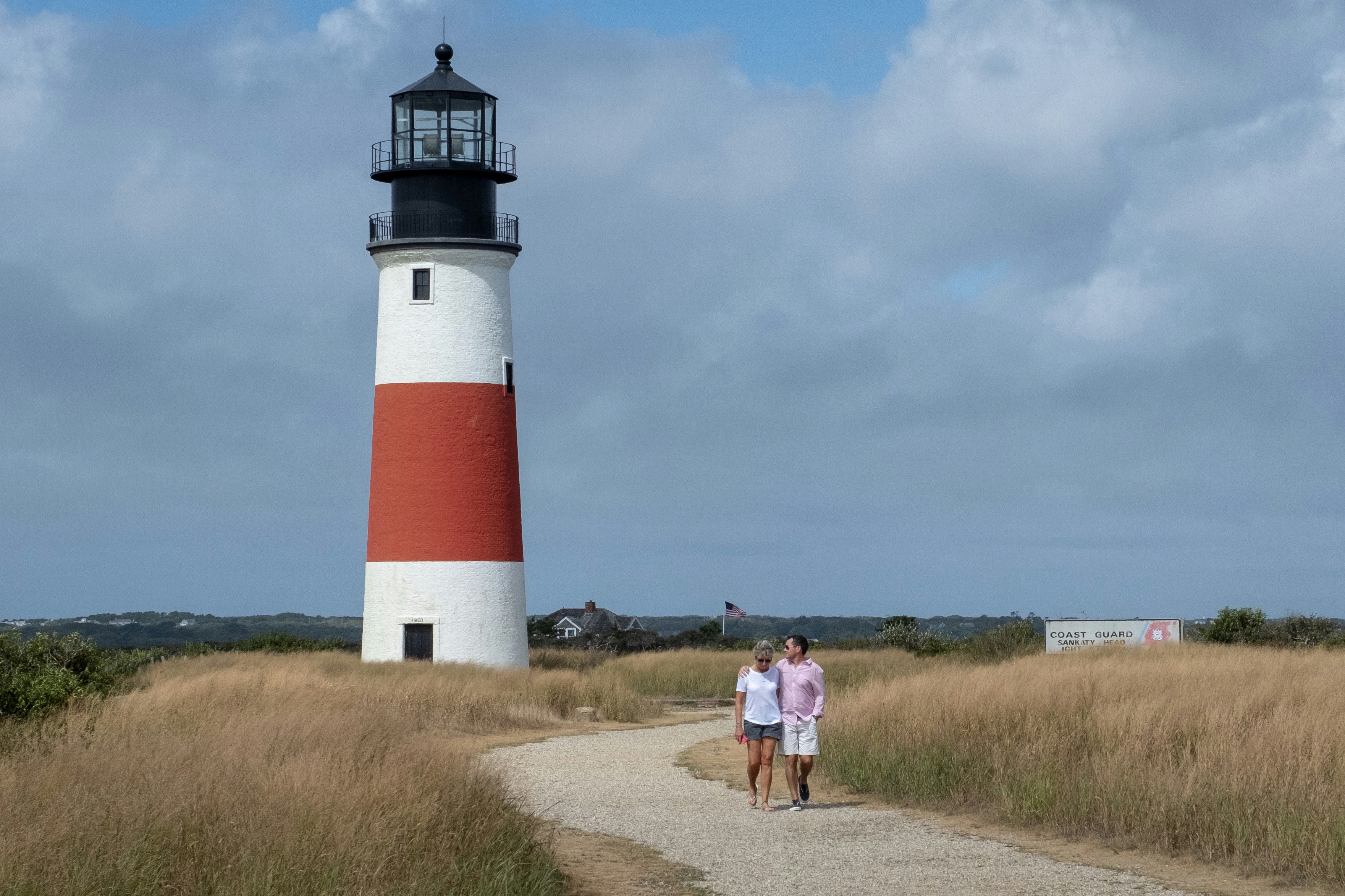 Shot while exploring Nantucket on a beautiful day. An embracing couple slowly walks along the park’s path. I slightly tweaked the colors of the lighthouse to enhance the red/orange portion to match the way it feels in my memory. 