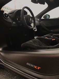 Luxurious Corvette C8 interior with custom leather and refined details in a minimalist setting.