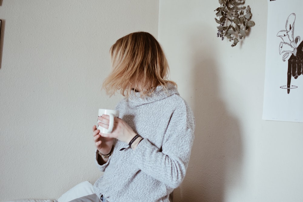 woman holding mug