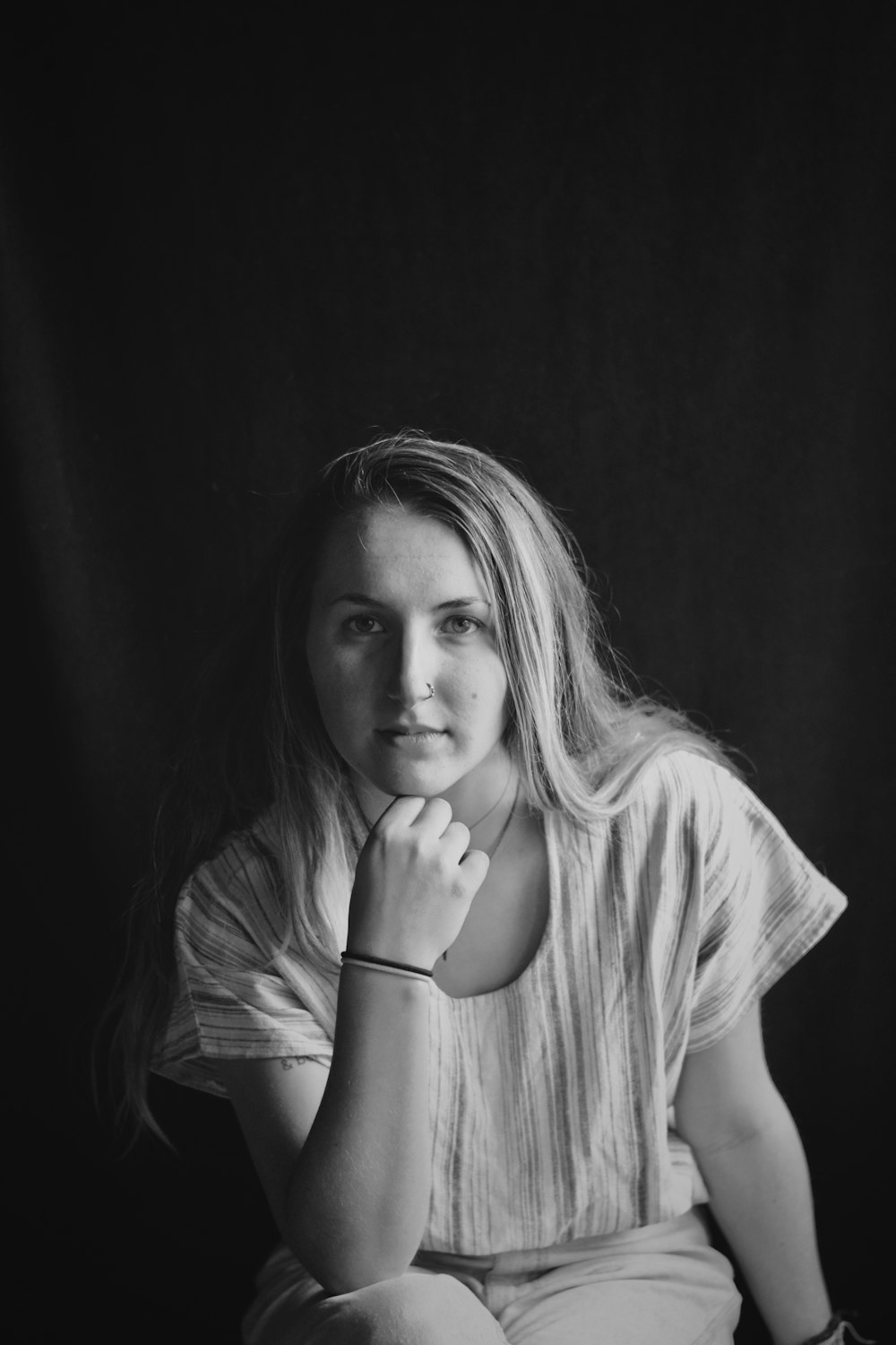 grayscale photo of woman in scoop-neck T-shirt