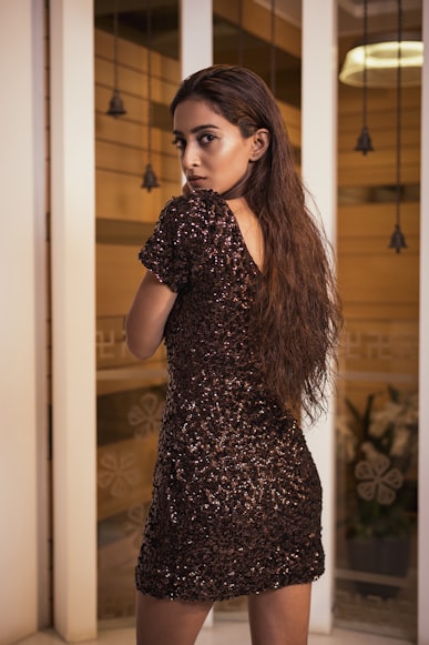 Woman with sequin evening dress photo by raj jariwala on unsplash.com