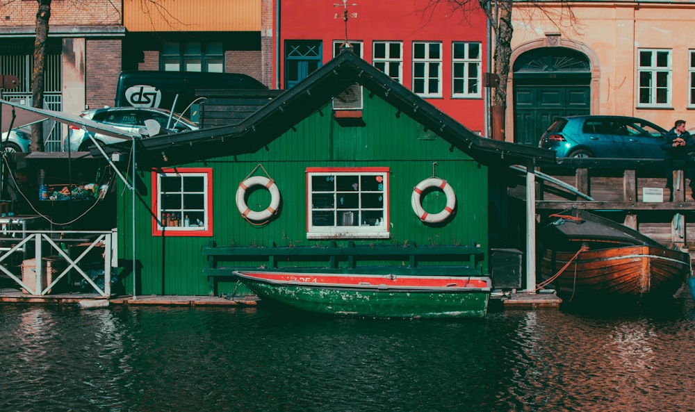 green house near body of water