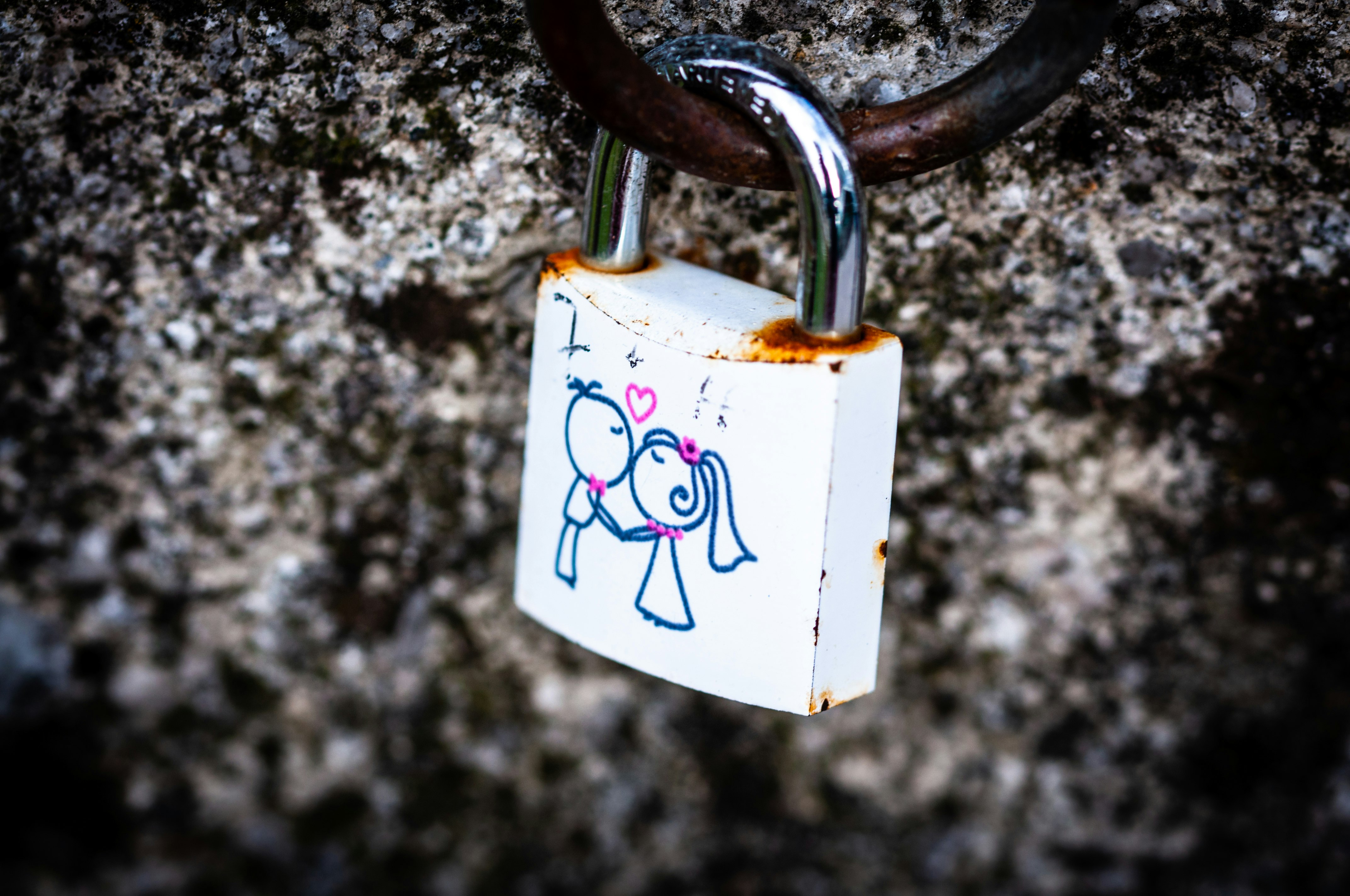 white and stainless steel padlock