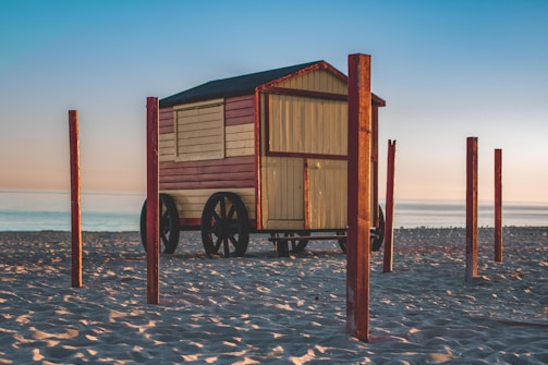 A sleek wooden soapbox cart on a sunny hill, ready to race.