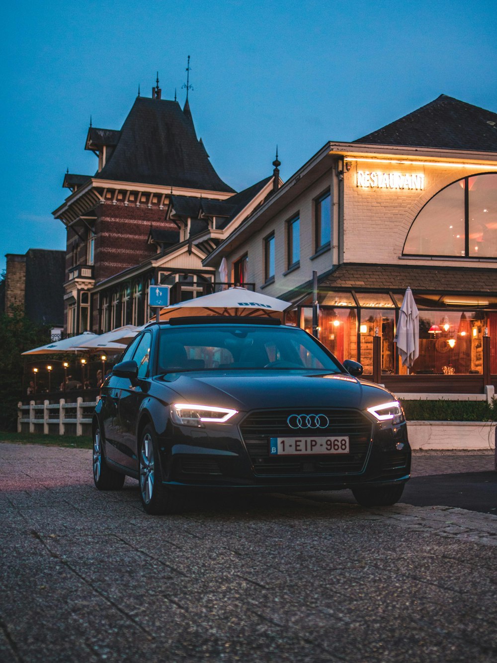 black Audi car near building