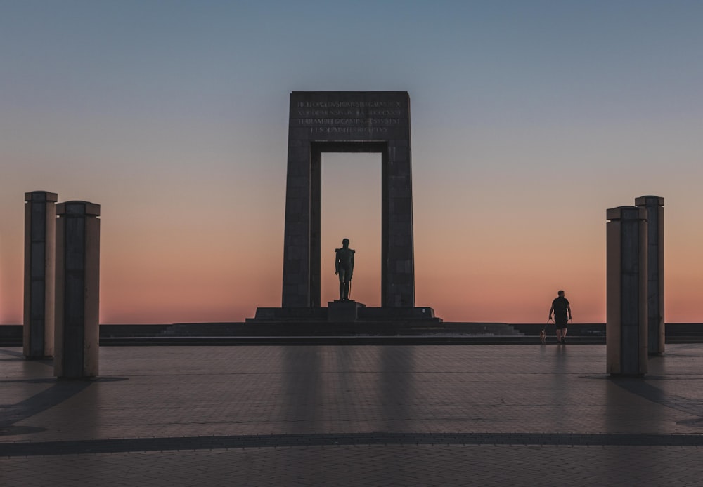person walking by monument during golden houre