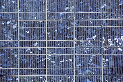 Close-up of high-performance solar panels with visible brand and technical details.