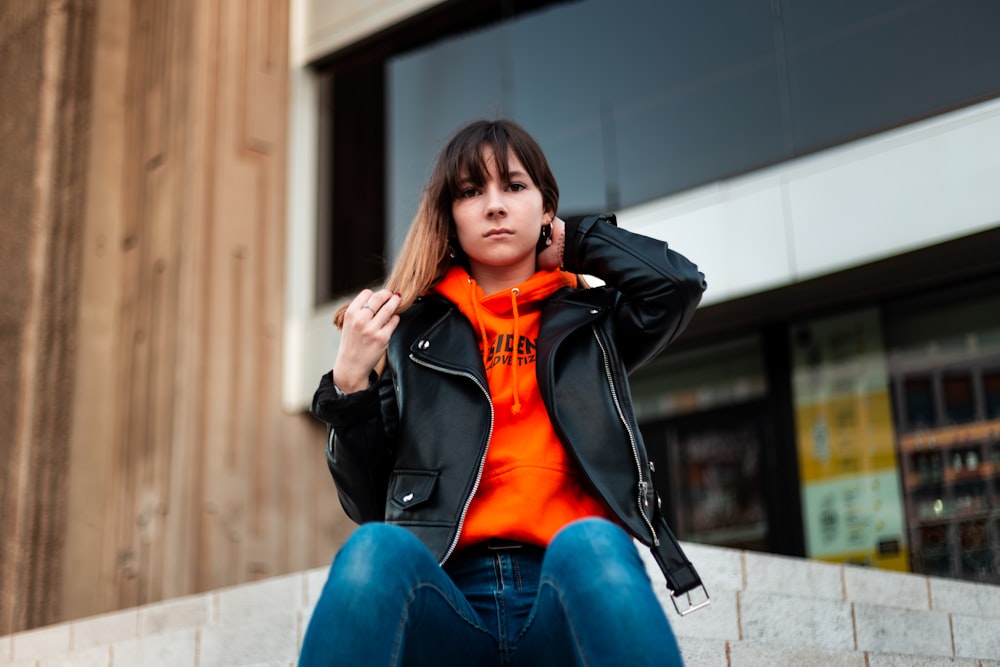 shallow focus photo of woman in black leather full-zip biker jacket