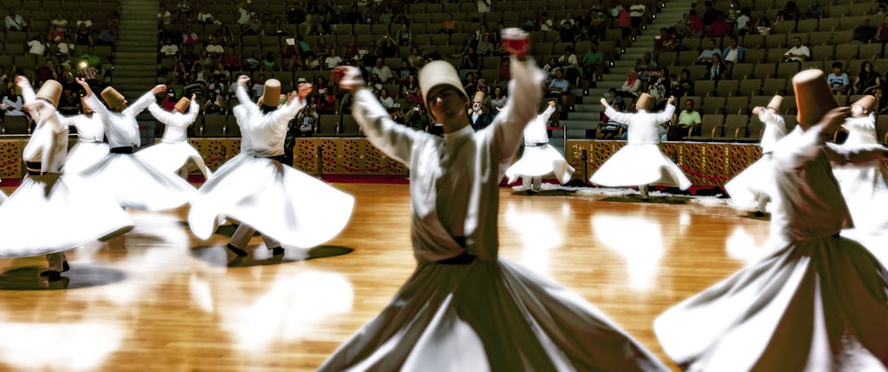 group of people dancing inside gymnasium