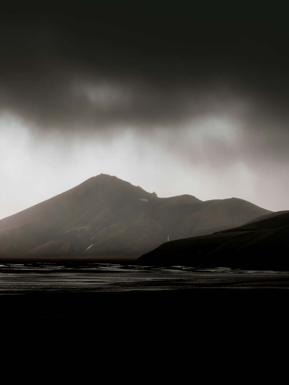 mountain near body of water