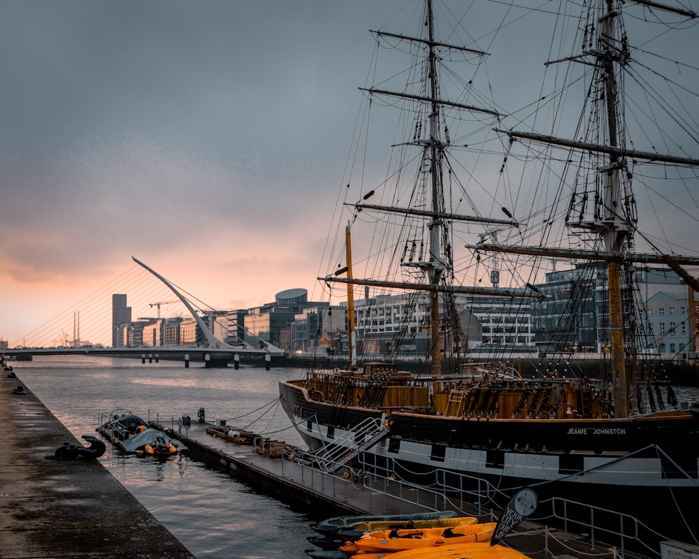 black and brown ship on body of water during daytime