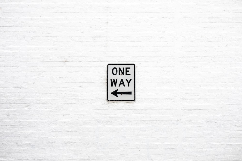 One Way arrow left signage