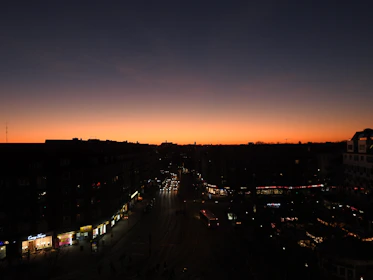 Cinematic shot of an urban scene at dusk with vibrant colors and dynamic contrast.
