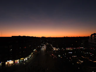 Cinematic shot of an urban scene at dusk with vibrant colors and dynamic contrast.