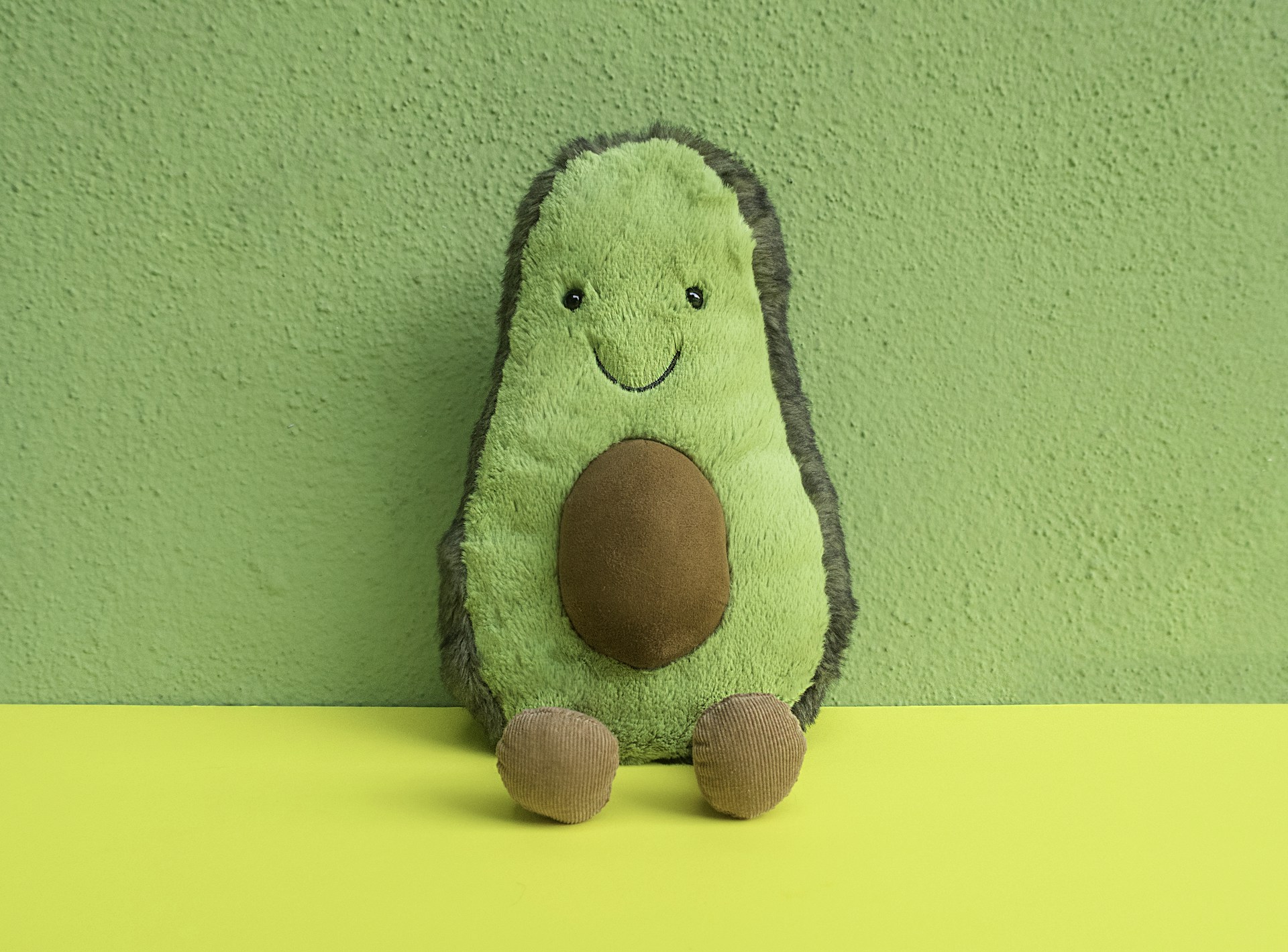 green and black animal plush toy